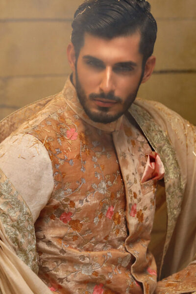 Add a vibrant touch to your Mehendi look with this elegant orange waistcoat. Crafted for comfort and style, it’s the perfect blend of tradition and modern elegance. Pair it with a kurta pajama for weddings, festive events, or cultural gatherings.