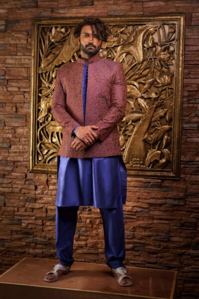 luxurious brown prince coat with intricate embroidery, paired with a contrasting blue kurta and pyjama