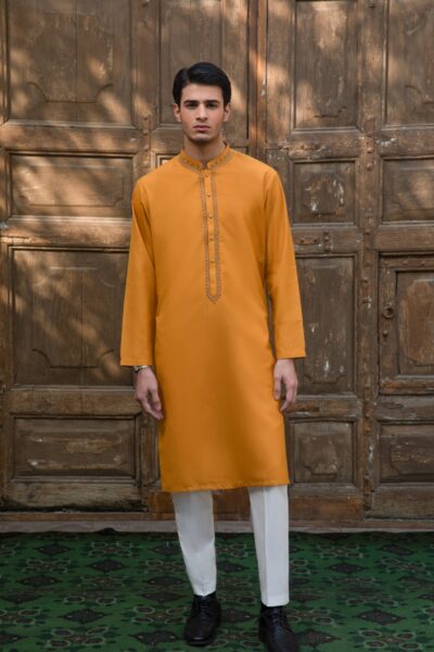 man wearing a luxury ochre yellow kurta for men with hand-embellished beadwork