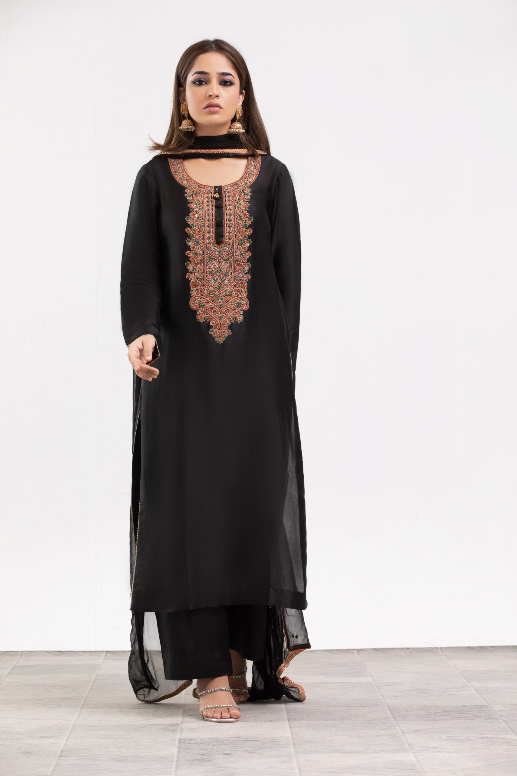 1000536281-scaled.jpg Black Ladies dress - Western Evening & Cocktail: Floor-length halter necklines, structured power shoulders, and side-slit satin or velvet slip dresses.