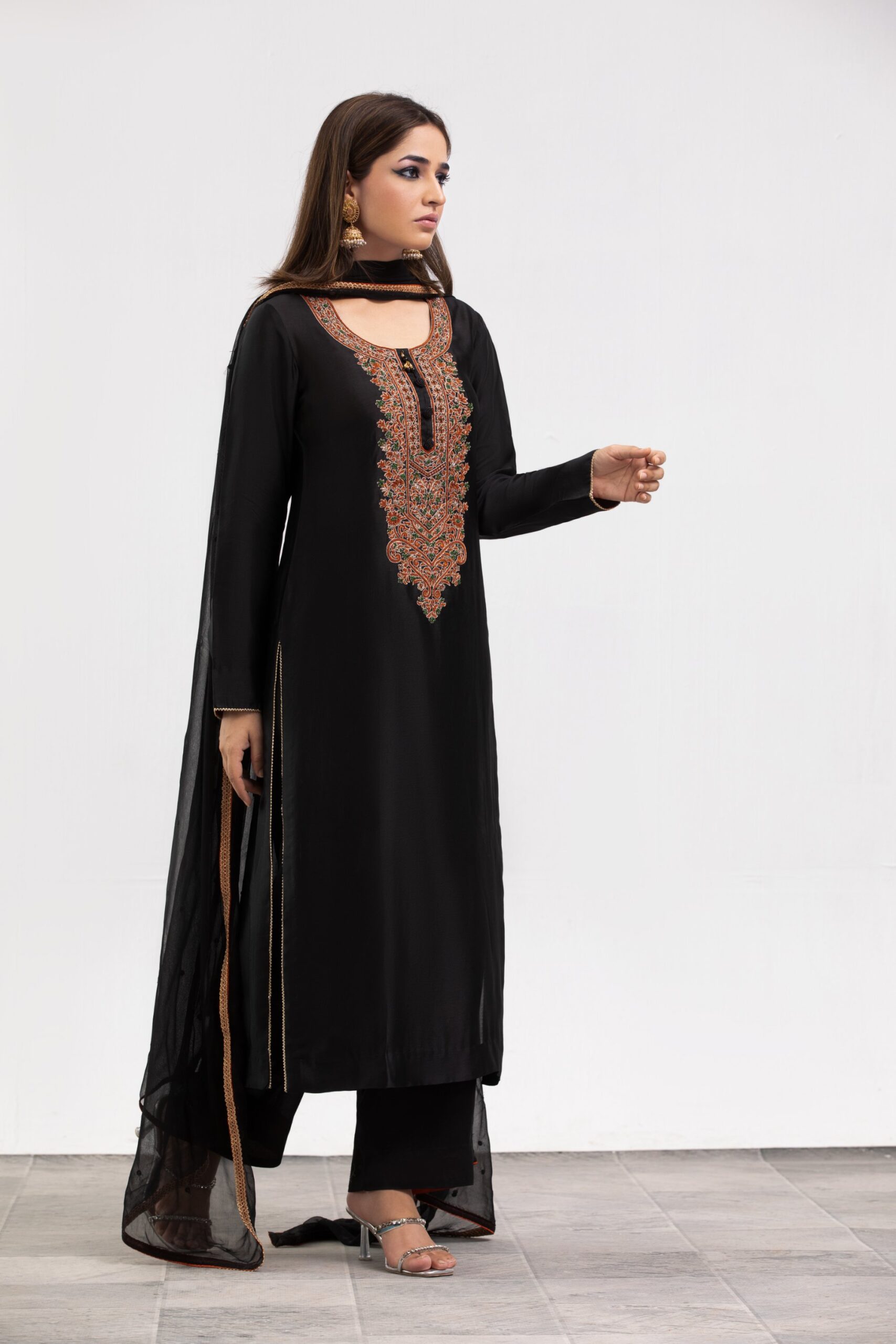 1000536284-scaled.jpg Black Ladies dress - Western Evening & Cocktail: Floor-length halter necklines, structured power shoulders, and side-slit satin or velvet slip dresses.
