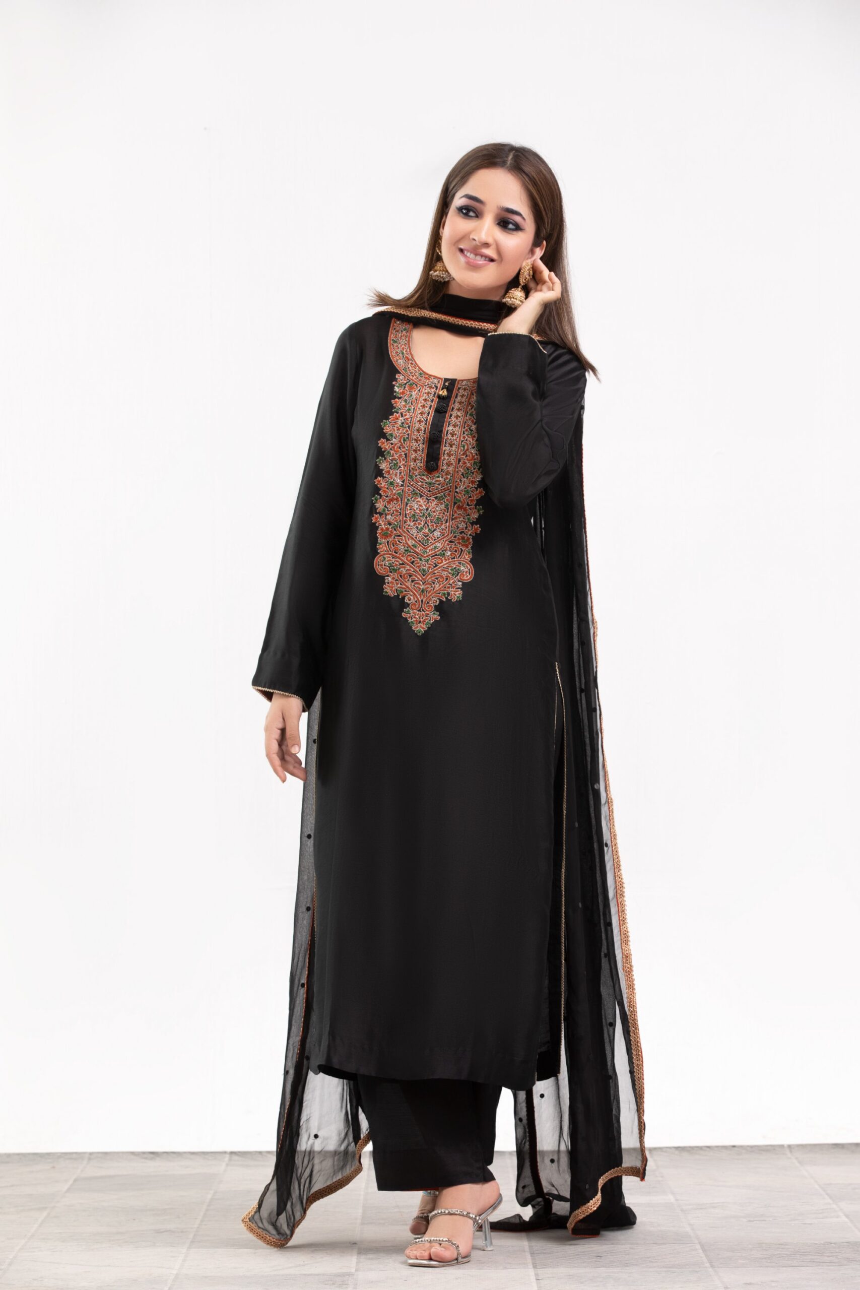 1000536286-scaled.jpg Black Ladies dress - Western Evening & Cocktail: Floor-length halter necklines, structured power shoulders, and side-slit satin or velvet slip dresses.