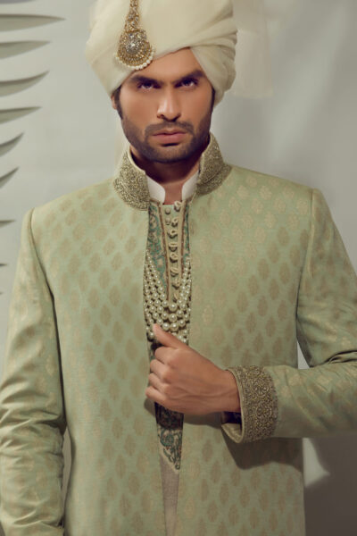 groom wearing TEA GREEN SHERWANI WITH MATCHING TURBAN designed by nauman arfeen