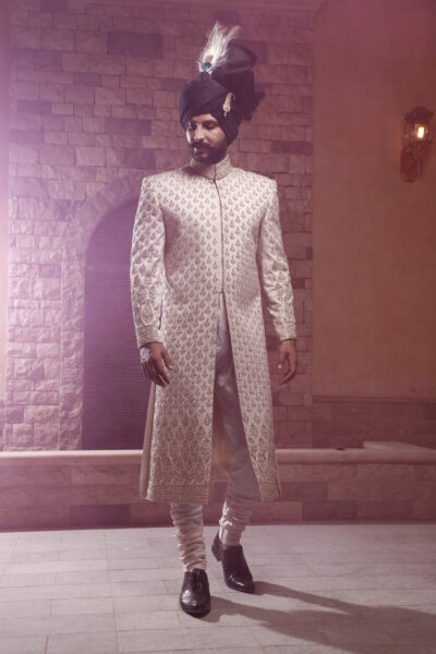 man wearing DAISY OFF WHITE SHERWANI for groom WITH MATCHING INNER SUIT AND BLACK TURBAN