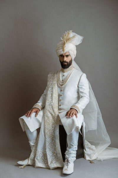WHITE SHERWANI PAIRED WITH MATCHING INNER SUIT, SHAWL AND TURBAN