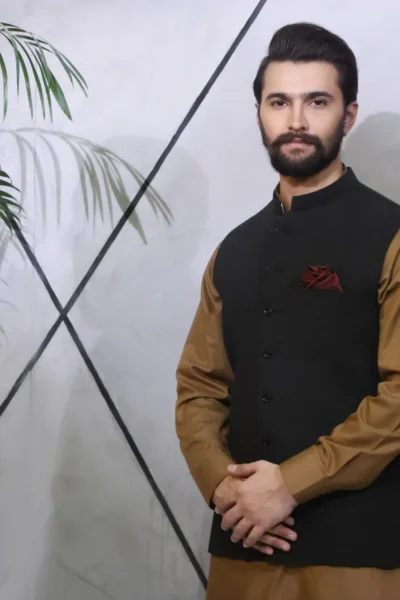 Plain Black Waistcoat paired gracefully with a Brown Kurta and Pajama