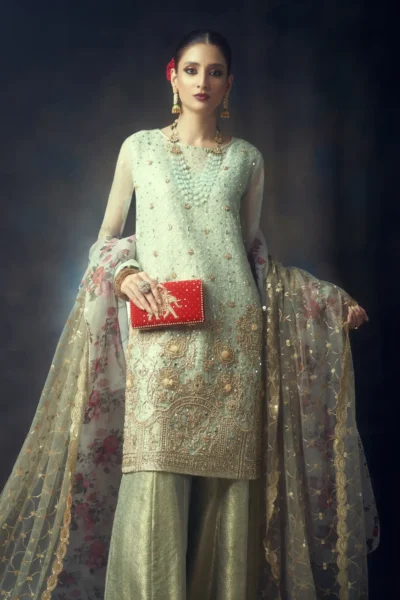 bride holding a bridal clutch purses and clutches for brides and women designed by the best fashion designer Naushemian by Nauman arfeen