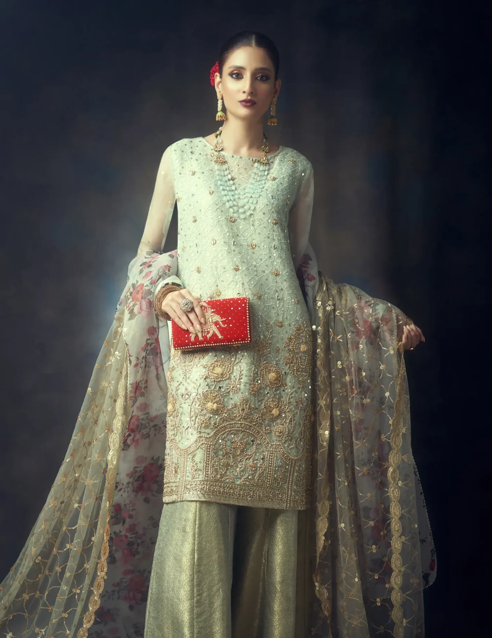 clutch for brides bride holding a bridal clutch purses and clutches for brides and women designed by the best fashion designer Naushemian by Nauman arfeen