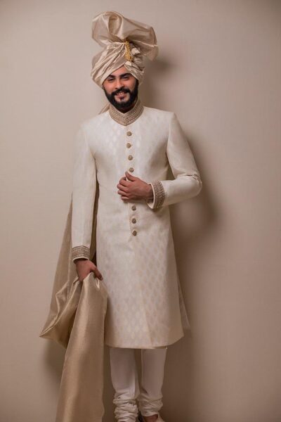 man wearing off white sherwani for groom on his wedding day - Groom wearing elegant sherwani designed by Naushemian by Nauman Arfeen - buy Sherwani for GRoom