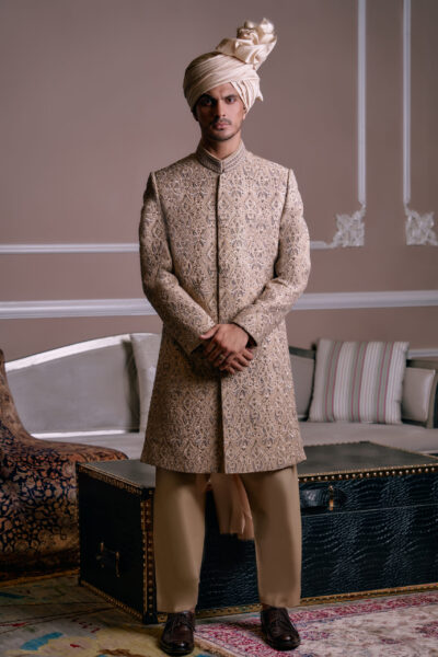 Trending Sherwani Designs - SAND GOLD SHERWANI PAIRED WITH MATCHING Trending Sherwani Designs - INNER SUIT, TURBAN AND SHAWL