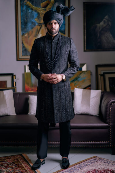 man wearing BLACK SHERWANi WITH MATCHING INNER SUIT AND TURBAN of naushemian by nauman arfeen