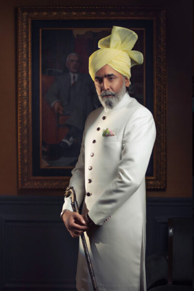 man wearing VISTA WHITE SHERWANI for father of bride or father of groom WITH MATCHING INNER SUIT AND CORNSILK TURBAN designed by naushemian by nauman arfeen on wedding day
