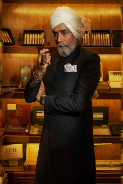 man wearing CARBON BLACK SHERWANI for father of bride or father of groom WITH MATCHING INNER SUIT, AND WHITE TURBAN on wedding day designed by naushemian by nauman arfeen