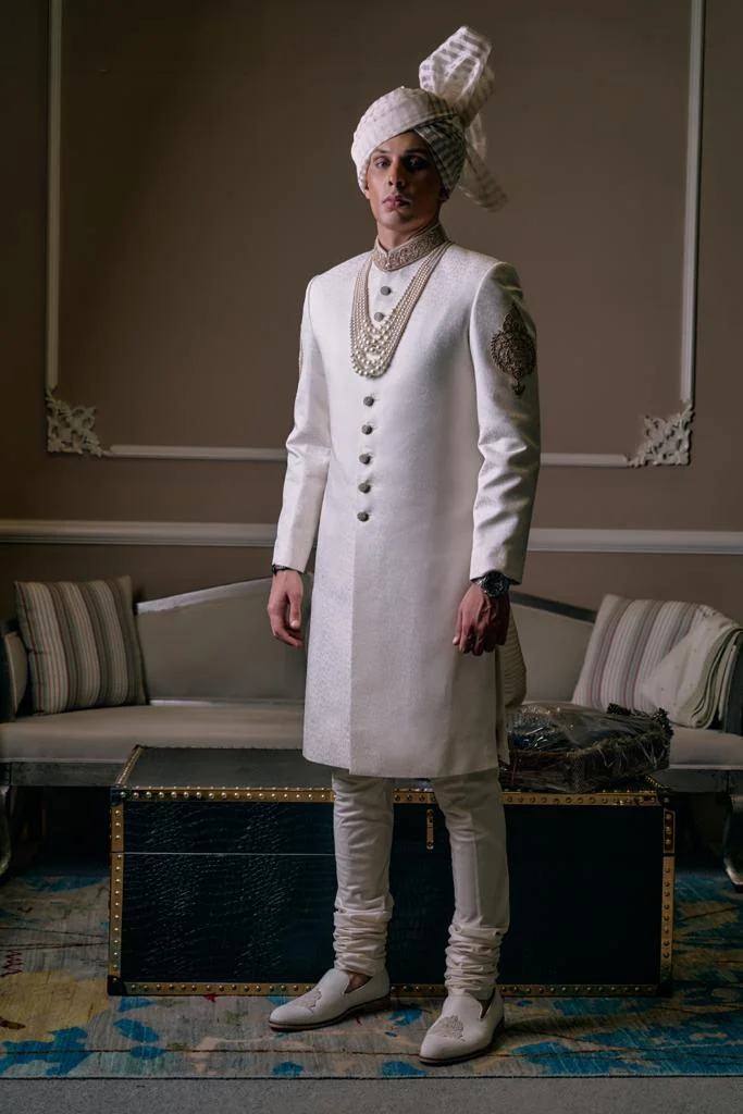 White Sherwani for groom with matching turban and matching sherwani inner suit