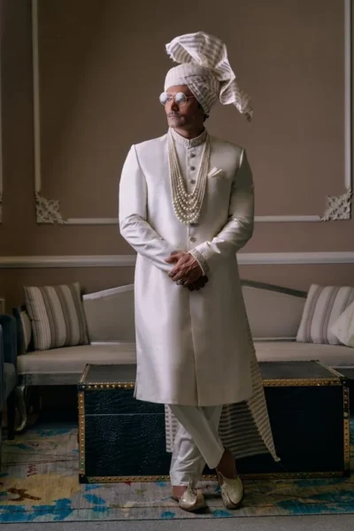 White Sherwani for groom with matching turban and matching sherwani inner suit