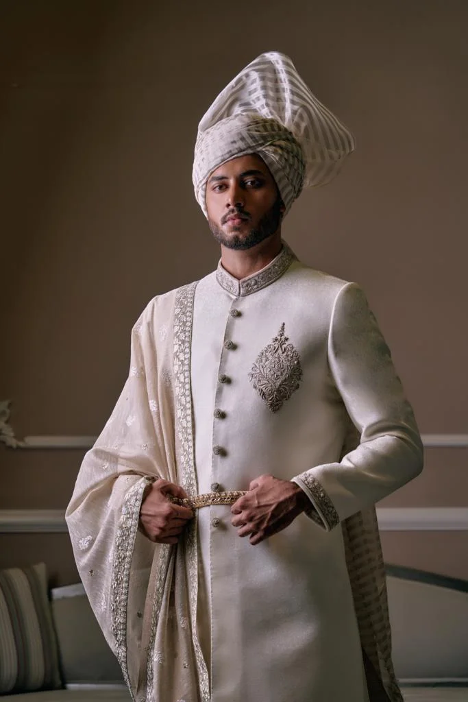 White Sherwani for groom with matching turban and matching sherwani inner suit