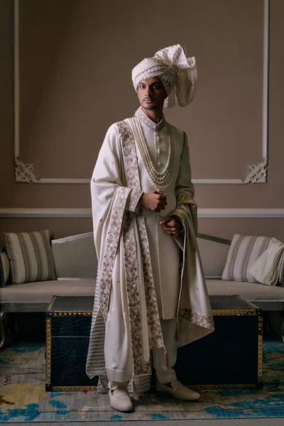 best fashion designer White Sherwani for groom with matching turban and matching sherwani inner suit