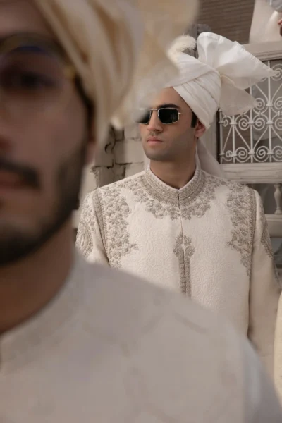 IVORY MAJESTY ROYAL SHERWANI IN EXQUISITE KORA WORK WITH REGAL EMBELLISHMENTS Group of men in designer Sherwani in karachi Pakistan of the best Mens wear designer in Pakistan best sherwani designer Naushemian by Nauman arfeen - Buy white sherwani for men