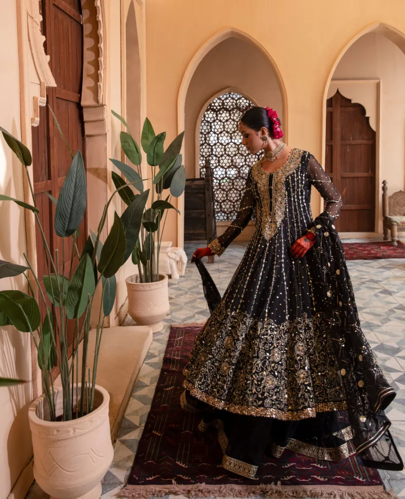 Enchanting Enigmatic layered black couture frock in net and luxurious fabric.