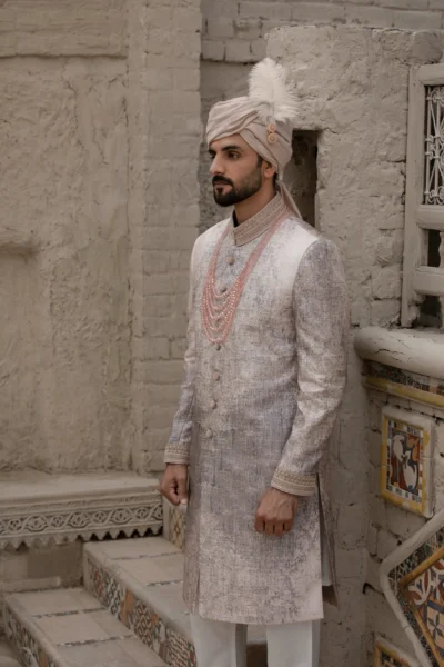 Elegant pearl white jacquard sherwani with intricate collar embroidery, made from luxurious jacquard fabric