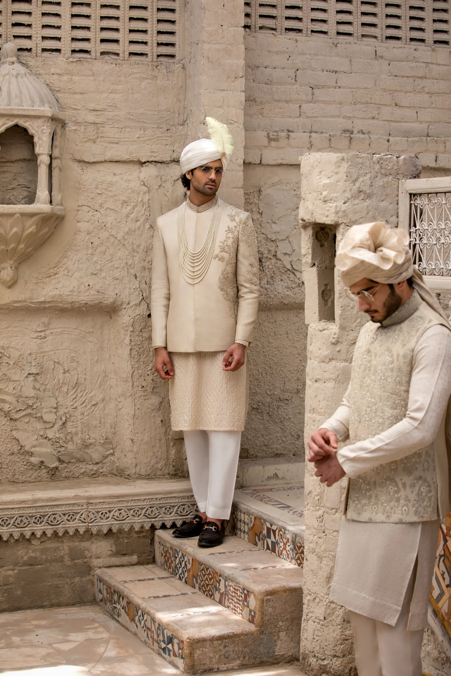 Stunning beige prince coat with intricate half embroidery on the front and full collar embroidery. Stunning beige prince coat with intricate half embroidery on the front and full collar embroidery.