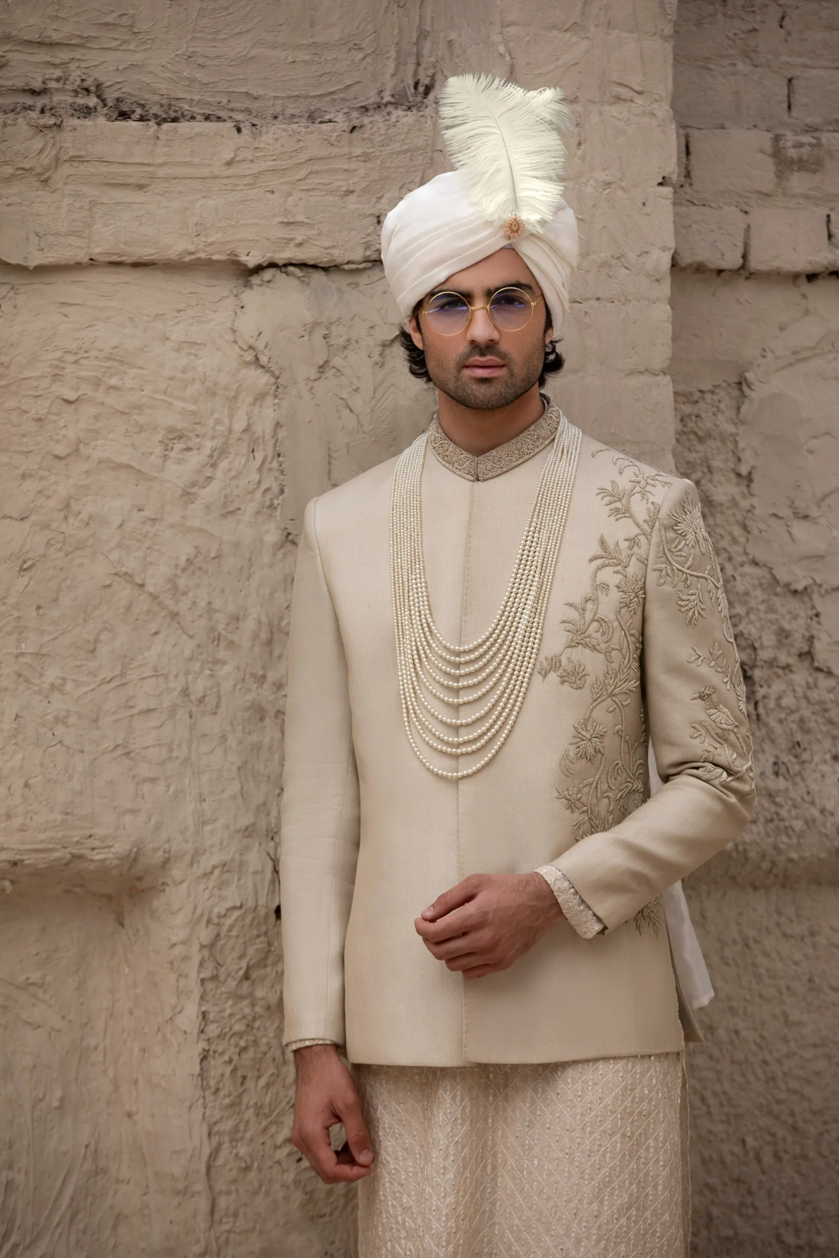 Stunning beige prince coat with intricate half embroidery on the front and full collar embroidery. Stunning beige prince coat with intricate half embroidery on the front and full collar embroidery.