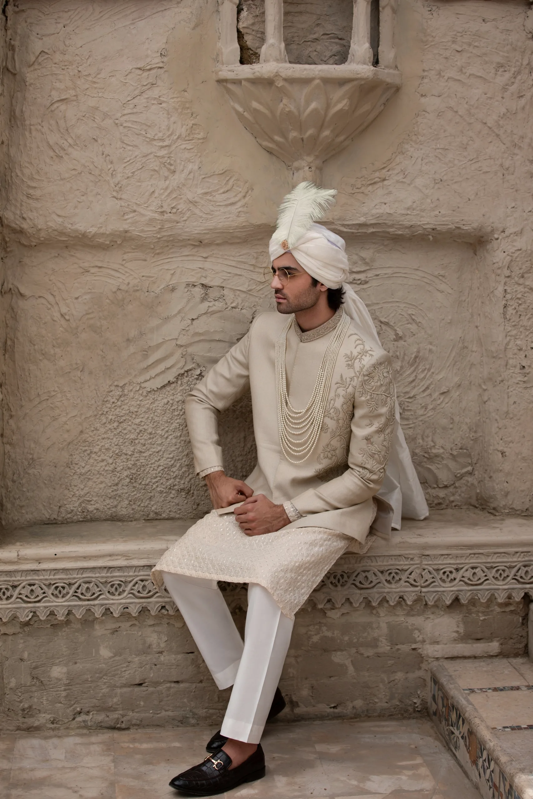 Stunning beige prince coat with intricate half embroidery on the front and full collar embroidery. Stunning beige prince coat with intricate half embroidery on the front and full collar embroidery.