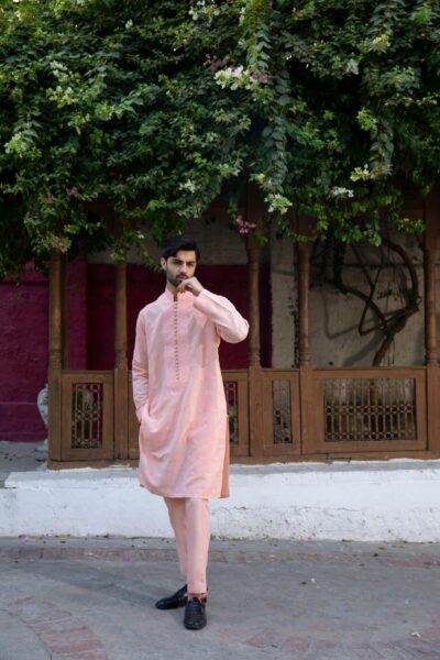 Pastel Peach designer kurta pajama set with intricate embroidery and luxurious synthetic raw silk, perfect for formal events and weddings