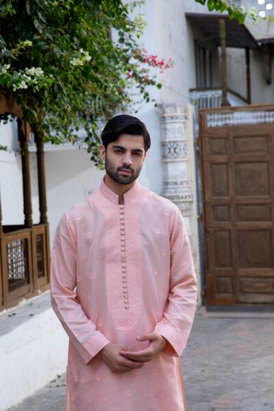 Pastel Peach men's kurta pajama set with intricate embroidery and luxurious synthetic raw silk, perfect for formal events and weddings