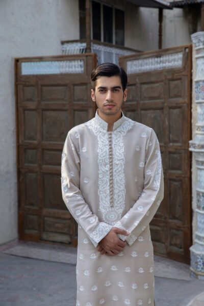 Off-white beige men's formal kurta with intricate front embroidered motifs and loop buttons, perfect for formal events, weddings, and festivals.