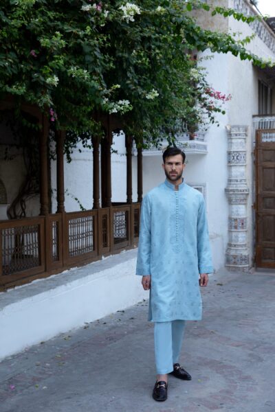 Blue men's kurta made from synthetic raw silk, featuring intricate front and collar embroidery and loop buttons, perfect for formal events and special occasions