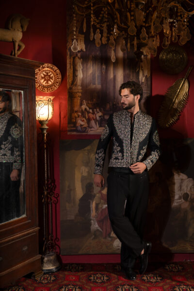 Imperial Éclat Prince Coat from Naushemian’s ÉTOILE Collection by Nauman Arfeen. A luxury velvet‑finish synthetic raw silk prince coat with motif embroidery, couture netted vest, and suiting trousers. Perfect for weddings, soirées, and cultural celebrations.