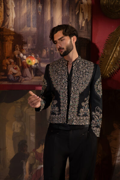 Imperial Éclat Prince Coat from Naushemian’s ÉTOILE Collection by Nauman Arfeen. A luxury velvet‑finish synthetic raw silk prince coat with motif embroidery, couture netted vest, and suiting trousers. Perfect for weddings, soirées, and cultural celebrations.