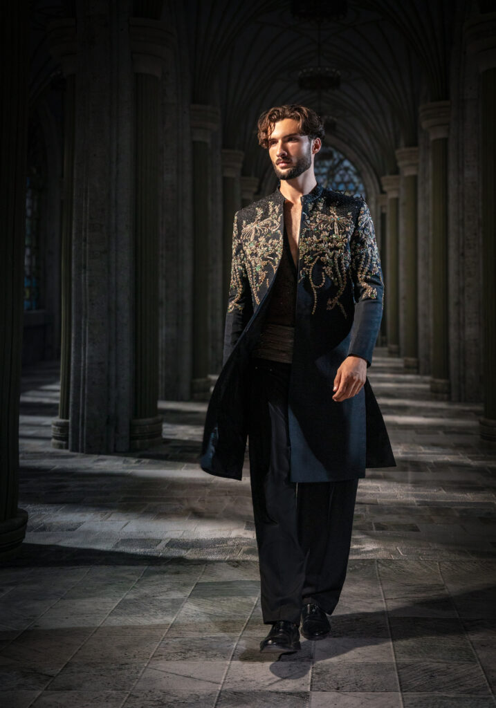 Nocturne Royal Black Embellished Couture Sherwani Set featuring intricate crystal embroidery across the front, shoulders and back, embellished inner shirt, statement waist detail, and tailored black trousers. Shop the Nocturne Royal Black Embellished Couture Sherwani Set featuring intricate hand embroidery, crystal embellishments, tailored trousers, and luxury craftsmanship by Nauman Arfeen. ÉTOILE is more than a collection. It is a story I have chosen to tell through fabric, craftsmanship, light and emotion. The Genesis is the first chapter of a five-part journey