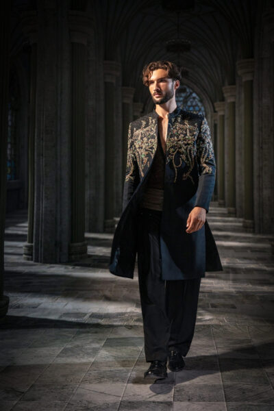 Nocturne Royal Black Embellished Couture Sherwani Set featuring intricate crystal embroidery across the front, shoulders and back, embellished inner shirt, statement waist detail, and tailored black trousers. Shop the Nocturne Royal Black Embellished Couture Sherwani Set featuring intricate hand embroidery, crystal embellishments, tailored trousers, and luxury craftsmanship by Nauman Arfeen. ÉTOILE is more than a collection. It is a story I have chosen to tell through fabric, craftsmanship, light and emotion. The Genesis is the first chapter of a five-part journey
