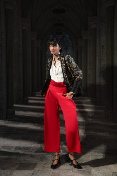 Rouge Constellation Embellished Couture Blazer and Scarlet Palazzo Set featuring multicolored crystal embroidery, handcrafted embellishments, tailored black blazer, ivory shirt, and wide-leg crimson trousers.. ÉTOILE collection by Nauman Arfeen is a story chosen to tell through fabric, craftsmanship, light and emotion. The Genesis is the first chapter of a five-part journey