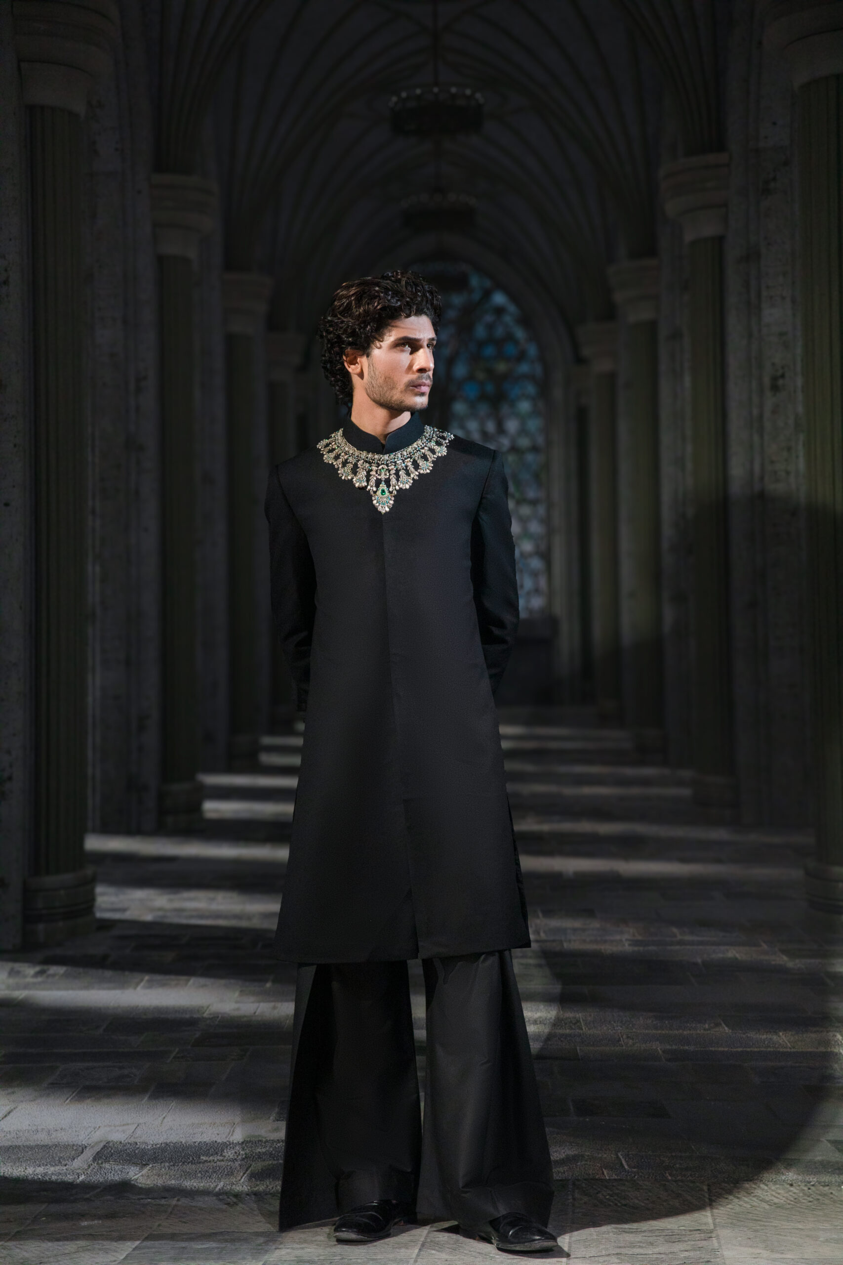 Black Sherwani, Naushemian ÉTOILE Collection, Nauman Arfeen Designer Wear, Luxury Suiting Blend Sherwani Pakistan, Plain Sherwani with Jewellery Accent, Fashion Week Couture 2026, Designer Groom’s Sherwani Pakistan, Heritage Craftsmanship Menswear, Regal Couture Tailoring, Luxury Occasion Dressing