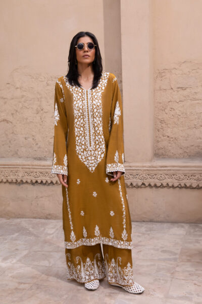 Rich mustard-coloured kurta Intricate white floral embroidery Elegant V-shaped embroidered neckline Full-length long kurta silhouette Embroidered sleeves and statement cuffs Scattered floral motifs on the kurta Detailed embroidered side borders Ornate embroidered kurta hem Wide-leg trousers Embroidered trouser hem Coordinated two-piece ensemble Suitable for festive and cultural occasions Elegant option for daytime and evening gatherings Contemporary silhouette with traditional detailing