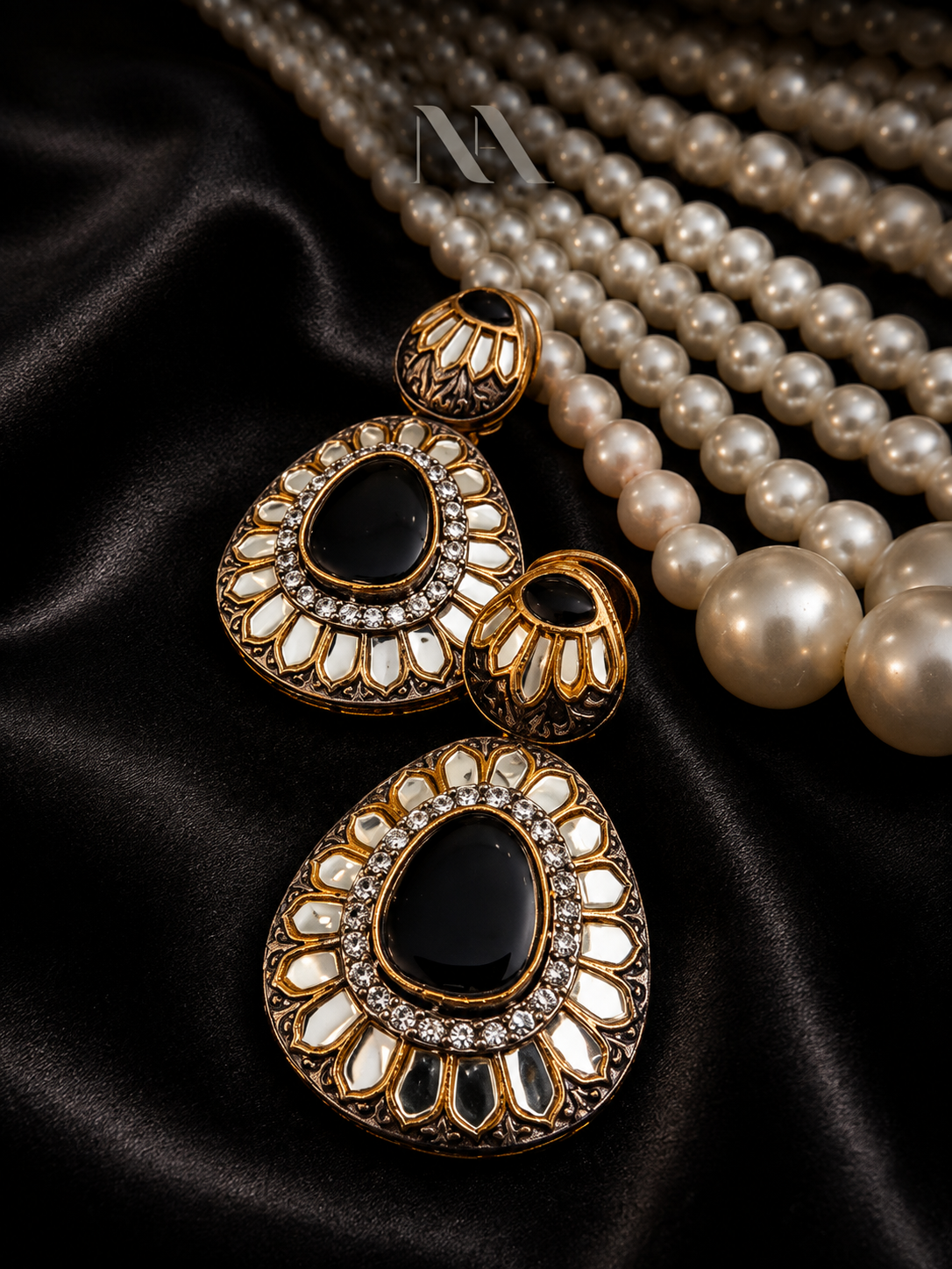 gold drop earrings Antique gold drop earrings with large black onyx stone and kundan mirror work. Regal statement jewelry