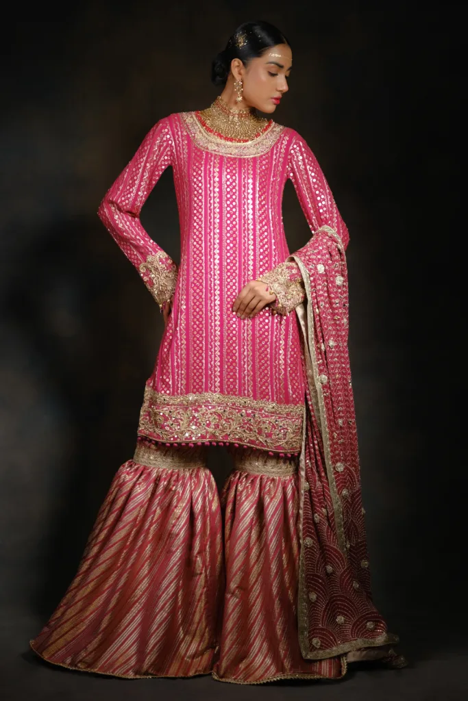 Bride in hot pink embroidered gharara set of Naushemian by Nauman Arfeen