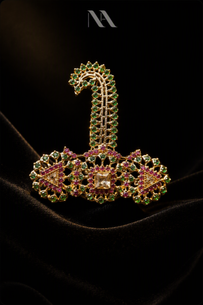 Gold Sarpech (Kalgi) with towering plume, set with Emerald and Ruby stones. Luxury groom turban wedding jewellery