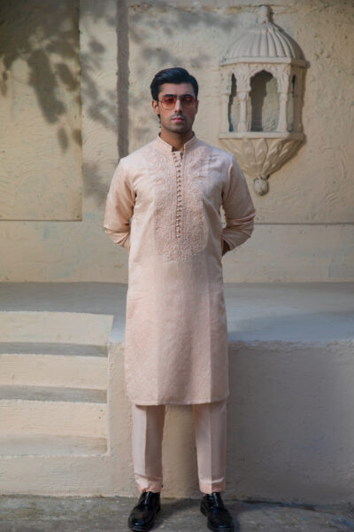 Peach Kurta for Men, Tonal Armor Embroidery, Luxury Wedding 2026, Sculpted Imperial Fit, Tapered Masculine Silhouette, Designer Peach Couture, Groom’s Nikah Statement, Elite Festive Power Wear, Artisan Breastplate Design, Bespoke Peach Luxury, High-Fashion Ethnic Dominance, Hand-Carved Threadwork, Premium Men’s Style Icon, Statuesque Presence, Bold Wedding Aesthetic, 2026 Fashion Architect, Individually Handcrafted, Unique Artisan Heritage