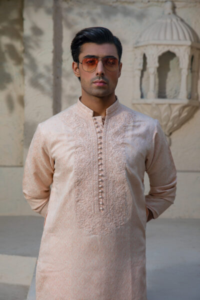 Peach Kurta for Men, Tonal Armor Embroidery, Luxury Wedding 2026, Sculpted Imperial Fit, Tapered Masculine Silhouette, Designer Peach Couture, Groom’s Nikah Statement, Elite Festive Power Wear, Artisan Breastplate Design, Bespoke Peach Luxury, High-Fashion Ethnic Dominance, Hand-Carved Threadwork, Premium Men’s Style Icon, Statuesque Presence, Bold Wedding Aesthetic, 2026 Fashion Architect, Individually Handcrafted