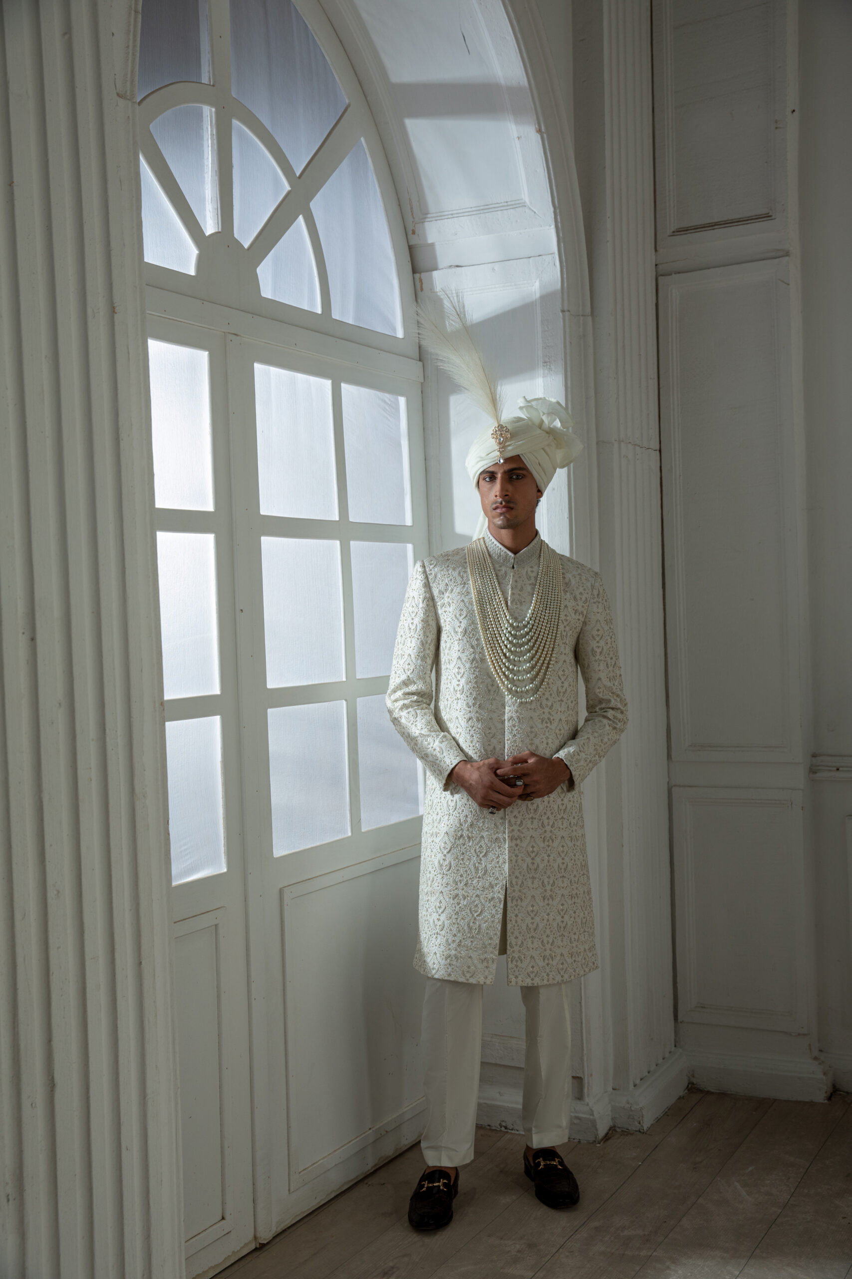 _F1A2111 Pakistani groom wedding sherwani by Naushemian Nauman Arfeen โ Divinus masterpiece design featuring intricate Kora embroidery, filigree detailing, embroidered shawl, regal turban, and handcrafted Khoosa shoes for luxury weddings