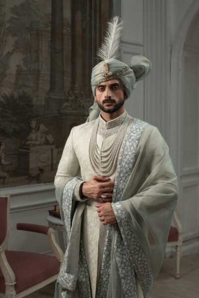 Pakistani wedding sherwani in mist green with full embroidery and regal accessories