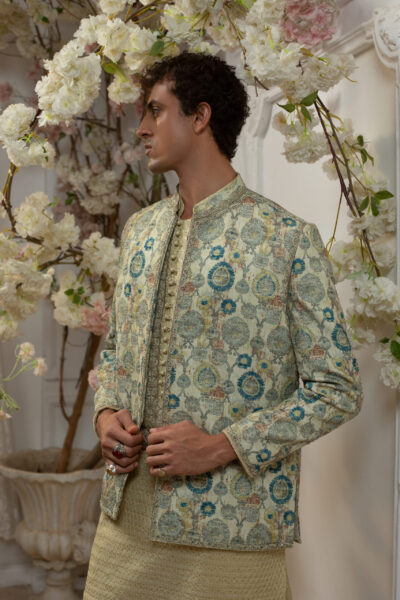 Stellar Radiance Prince Coat in digital print raw silk, adorned with sequins and jewel crystal handwork. Paired with a fully embroidered kurta, perfect for Pakistani weddings.