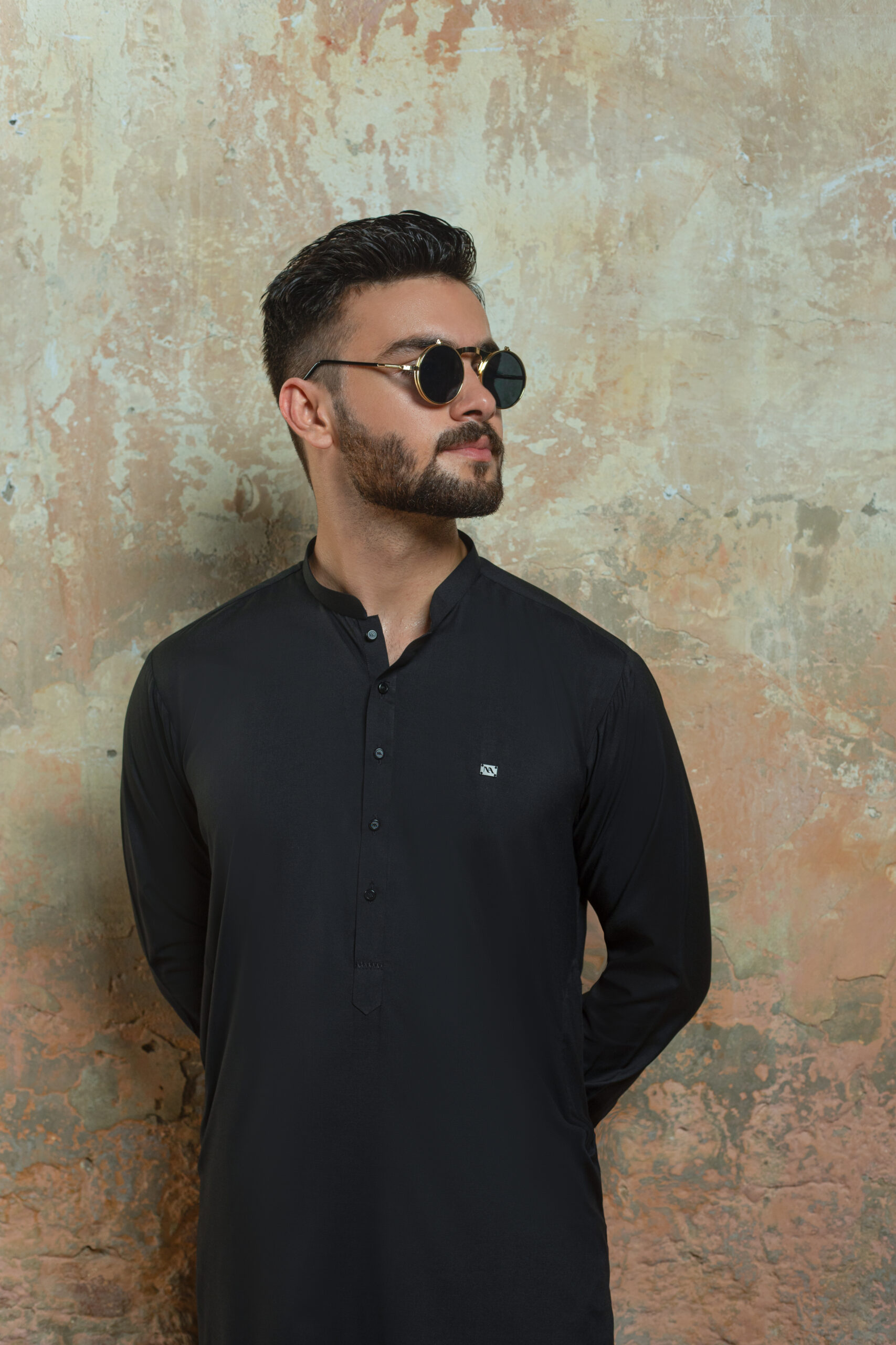 _F1A2843 Close-up of Premium Black Kurta cuff and fabric detail. Showing texture of Band Collar Kurta and refined cuff of Luxury Black Shalwar Kameez by Naushemian.