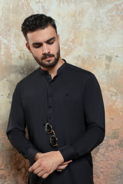 Close-up of Premium Black Kurta cuff and fabric detail. Showing texture of Band Collar Kurta and refined cuff of Luxury Black Shalwar Kameez by Naushemian.