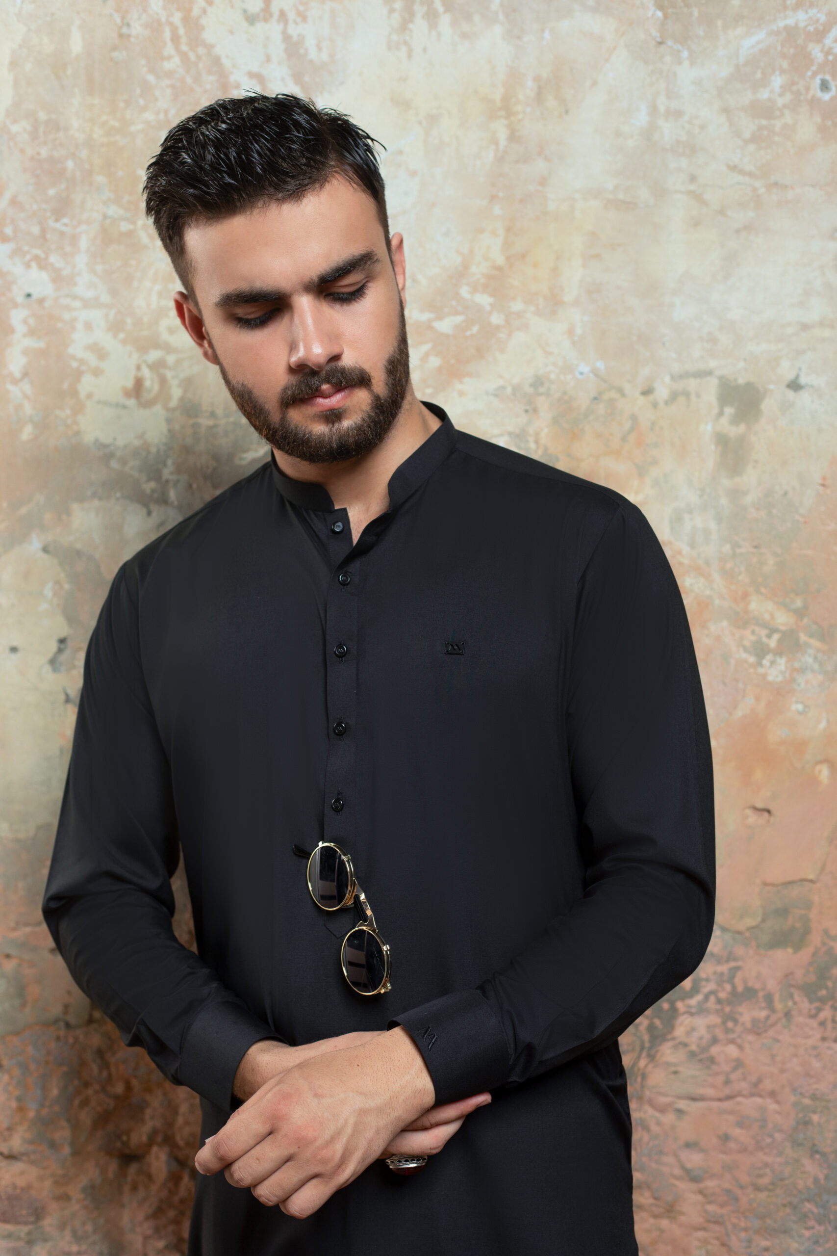 _F1A2849 Close-up of Premium Black Kurta cuff and fabric detail. Showing texture of Band Collar Kurta and refined cuff of Luxury Black Shalwar Kameez by Naushemian.