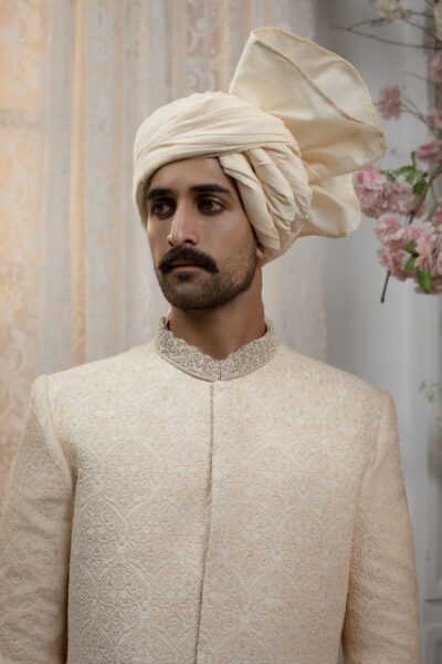 Pakistani Groom Wearing Timeless Traditional Sherwani with Turban - Royal Sherwani for Groom 2025 by Nauman Arfeen – Luxury Pakistani Wedding Sherwani in traditional heritage design with embroidery and prince coat style